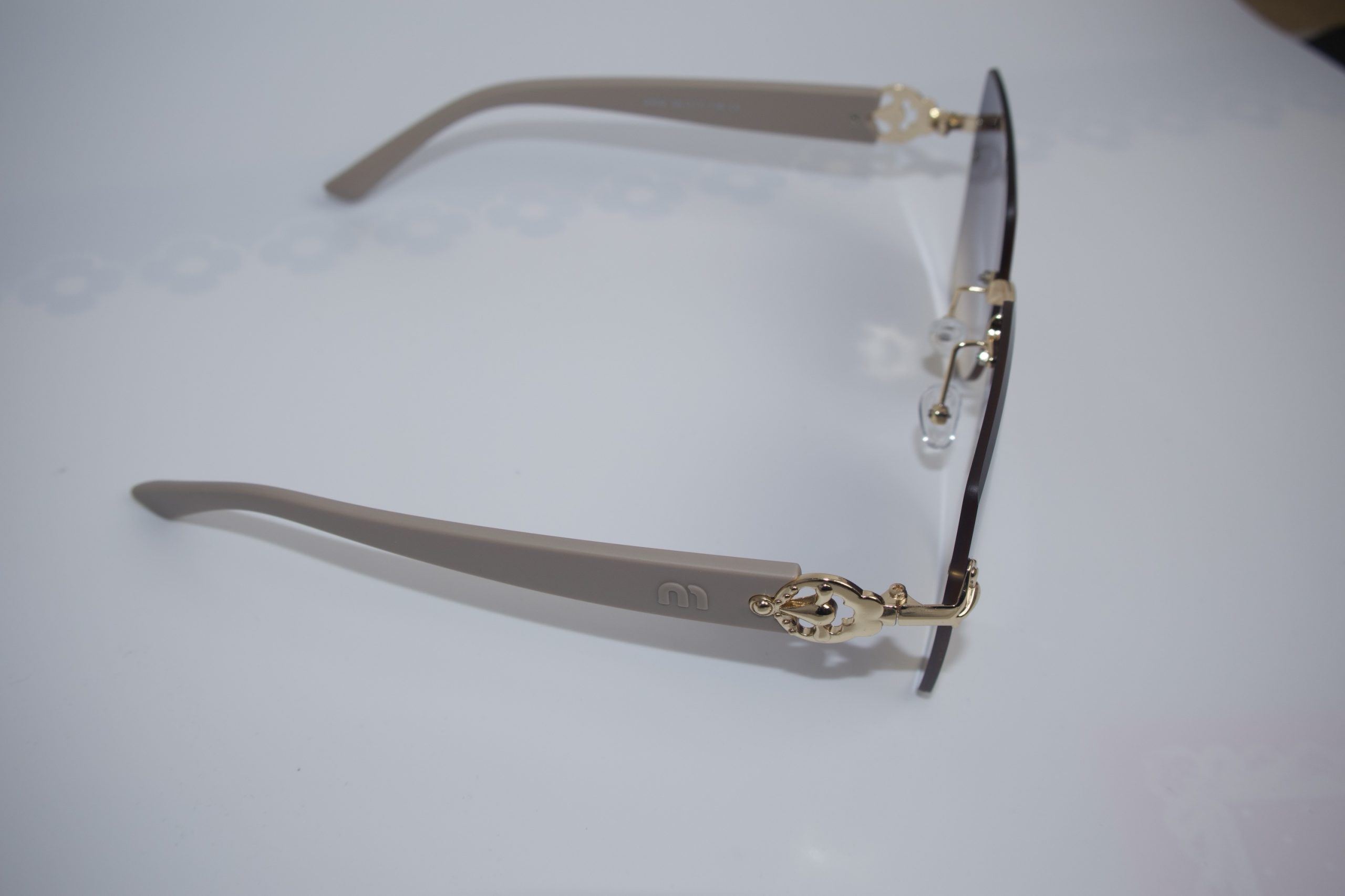 Rimless sunglasses with gold-tone